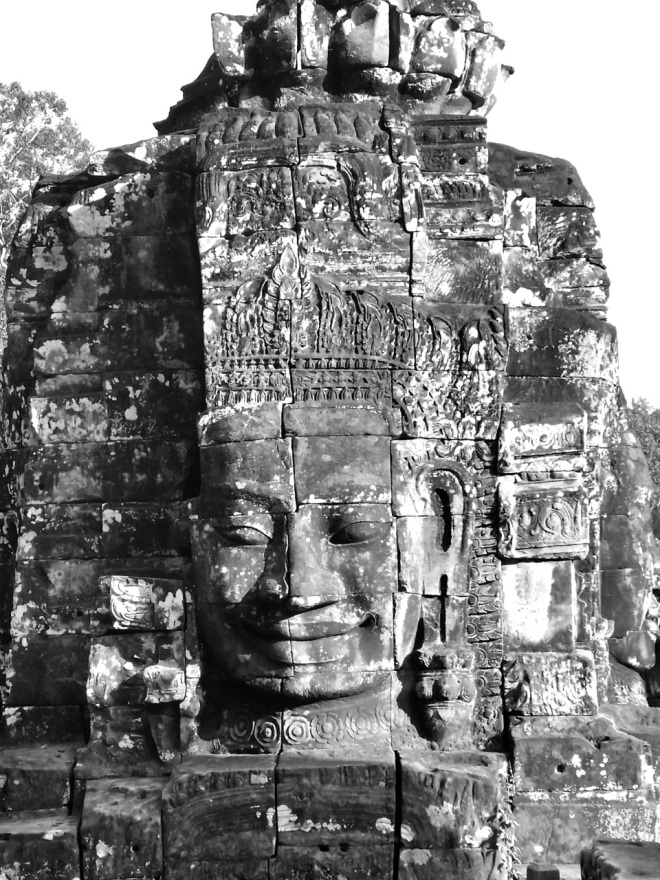 the smiling buddha in Bayon Temple